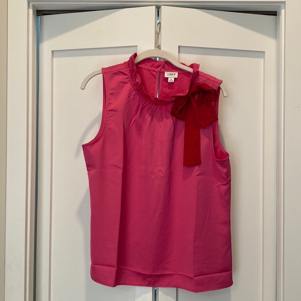 Sleeveless J. Crew top with ruffled collar and red bow detail!